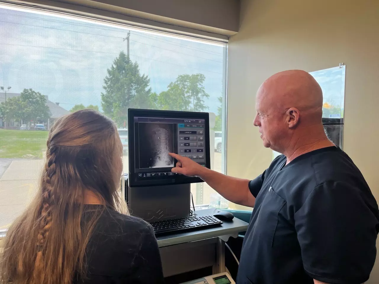 QC Wellness Group offers chiropractic care with 2 or 3 visit options and up to 50% discount - Primary Image