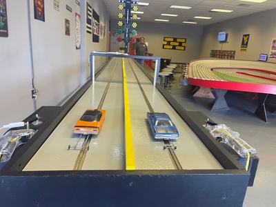 3 Passes for Drag Race for Two People - The Checkered Flag Slot Car and RC Complex