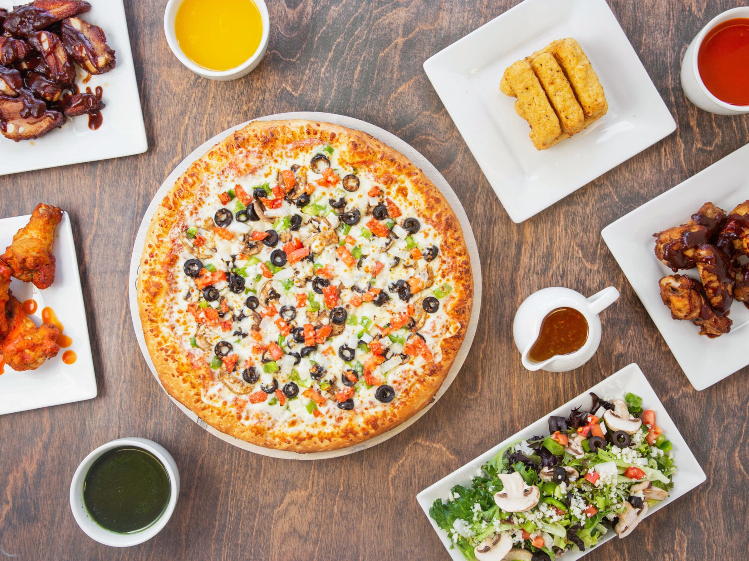 Fresh Dough Pizzas with Toppings and Sides Included