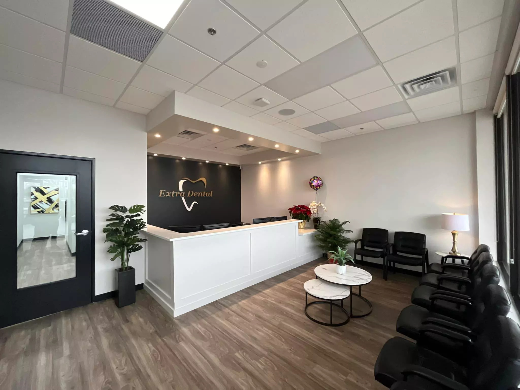 Visit Extra Dental for a comprehensive exam with cleaning and X-rays, offering up to 50% off for optimal oral health - Primary Image