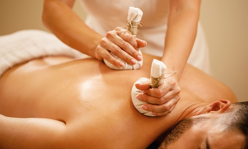 Image 2: Experience a 60-Minute Thai Massage with Hot Stones or Essential Oils