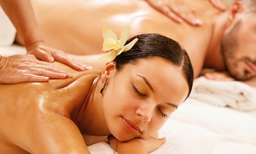 Image 1: Get a One-hour Full Body Thai/ Oil Combination and Hot Stone Massage