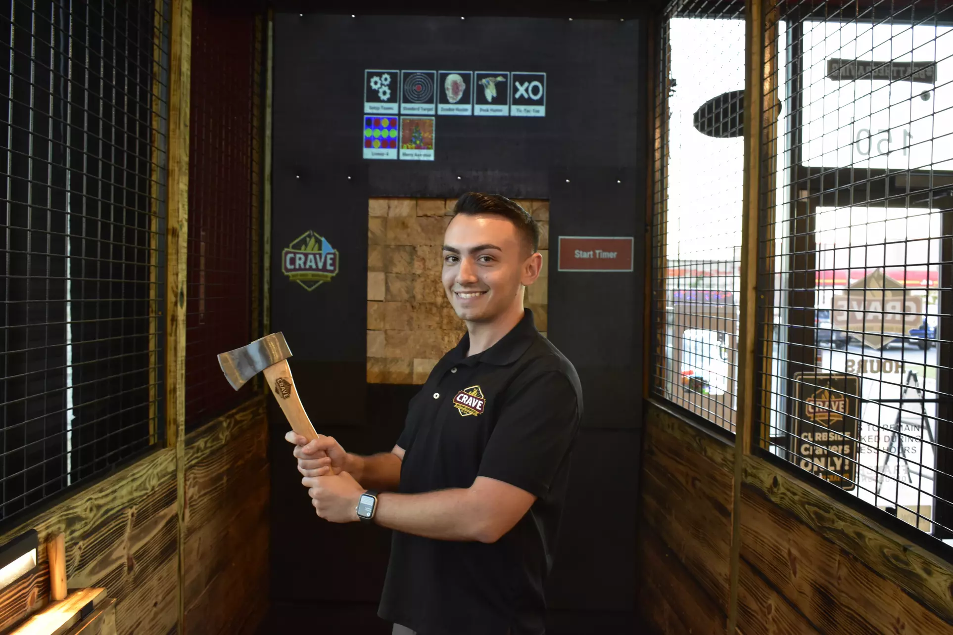 Feel the Thrill of Interactive Ax Throwing at Crave Hot Dogs and BBQ 