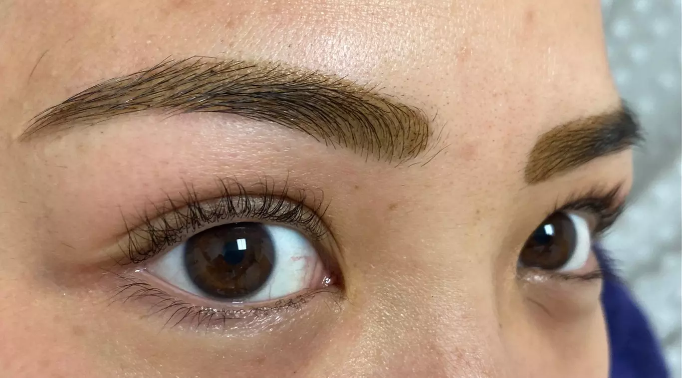 Discover ABUNDANCE BEAUTY's eyebrow shaping with threading and henna, offering up to 33% off for stunning brows - Primary Image