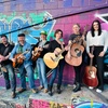 Image 1: Up to 50% Off on 4 Group Guitar Lessons at Strum and Sip