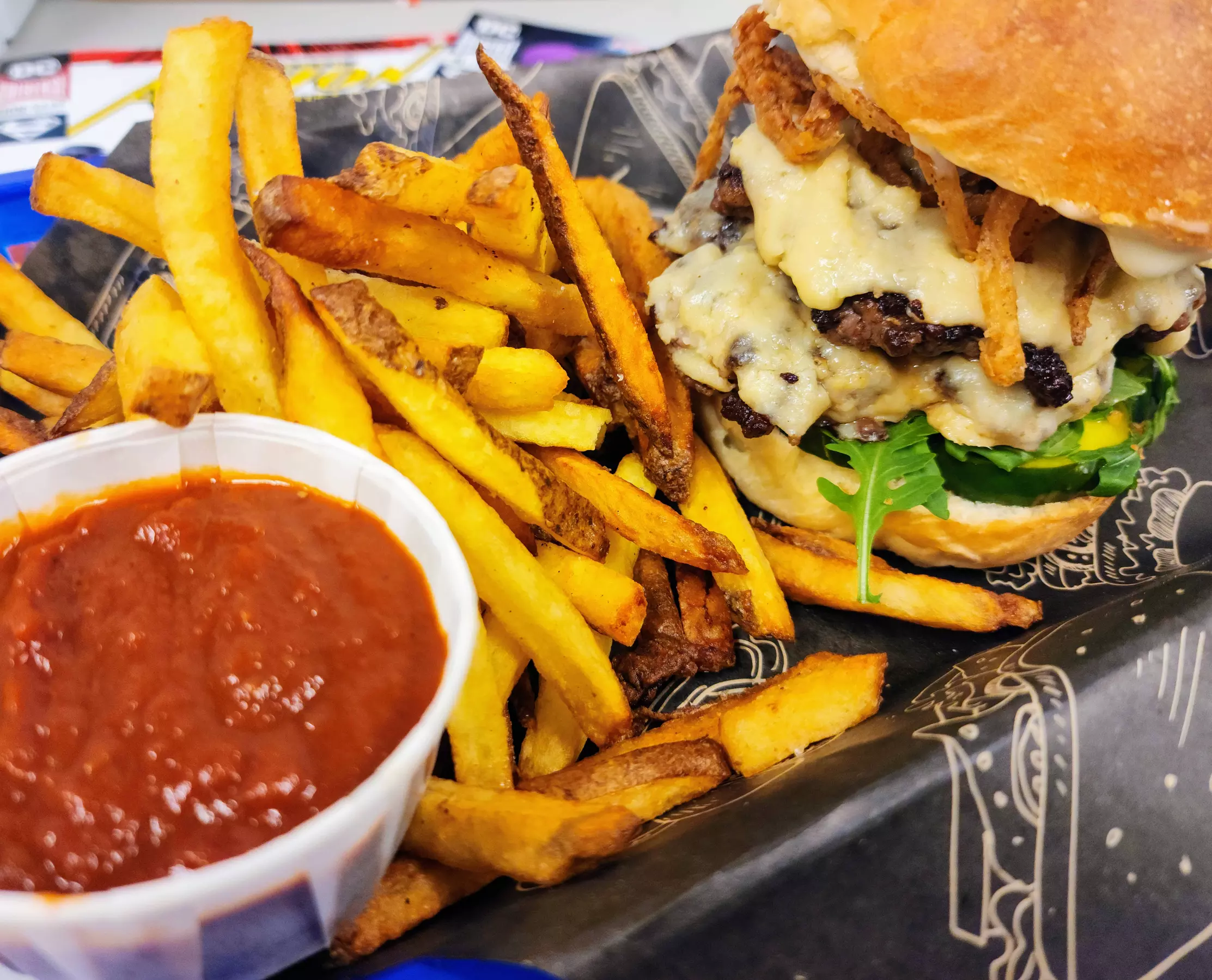 Up to 17% Off on Burger Restaurant at Omar's World of Comics & Hobbies - Second Medium