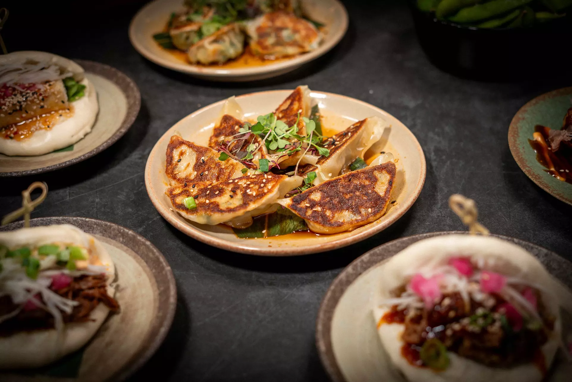 Savor Bao Buns, Sides, and Drinks for up to Four!