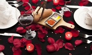 Cena romántica para dos + decoración + copas de vino con 39% off