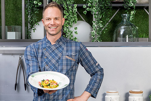 Chef presenting final dish