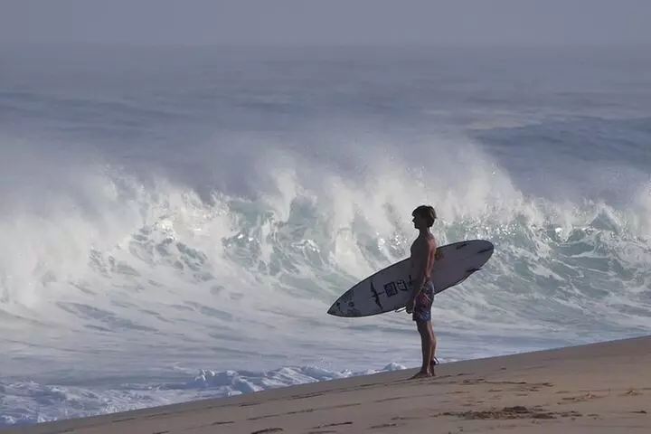 Learn to surf with a local big wave rider on the North Shore of Oahu