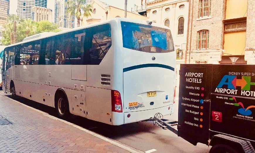 Image 4: Sydney Airport to Sydney CBD shared ride seat in vehicle shuttle tr...