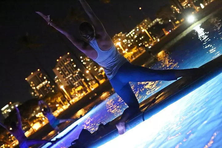Night SUP Yoga in Honolulu, Hawaii