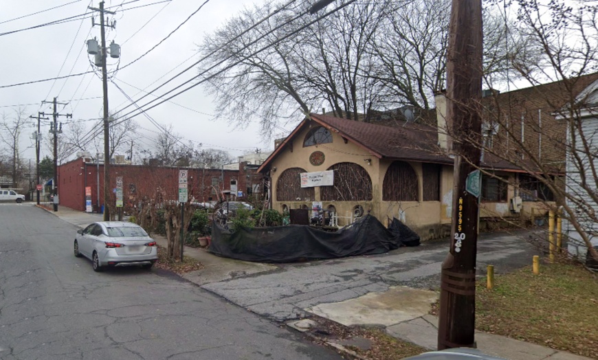 Image 1: Parking at Alley Entrance - 1039 Greenwood Ave. NE. Lot