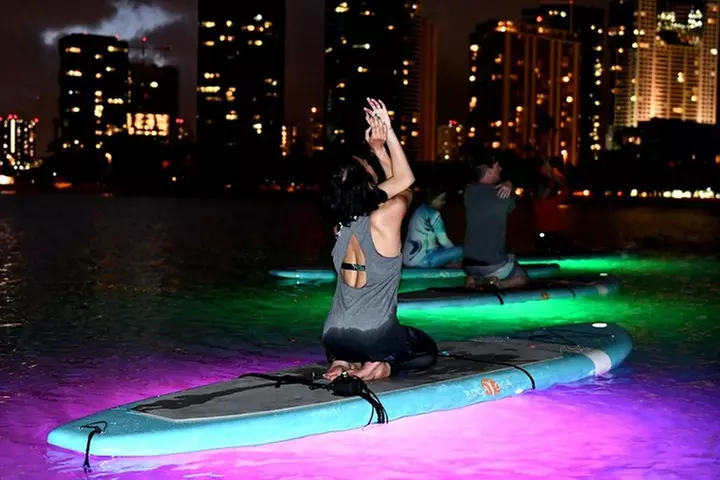 Night SUP Yoga in Honolulu, Hawaii