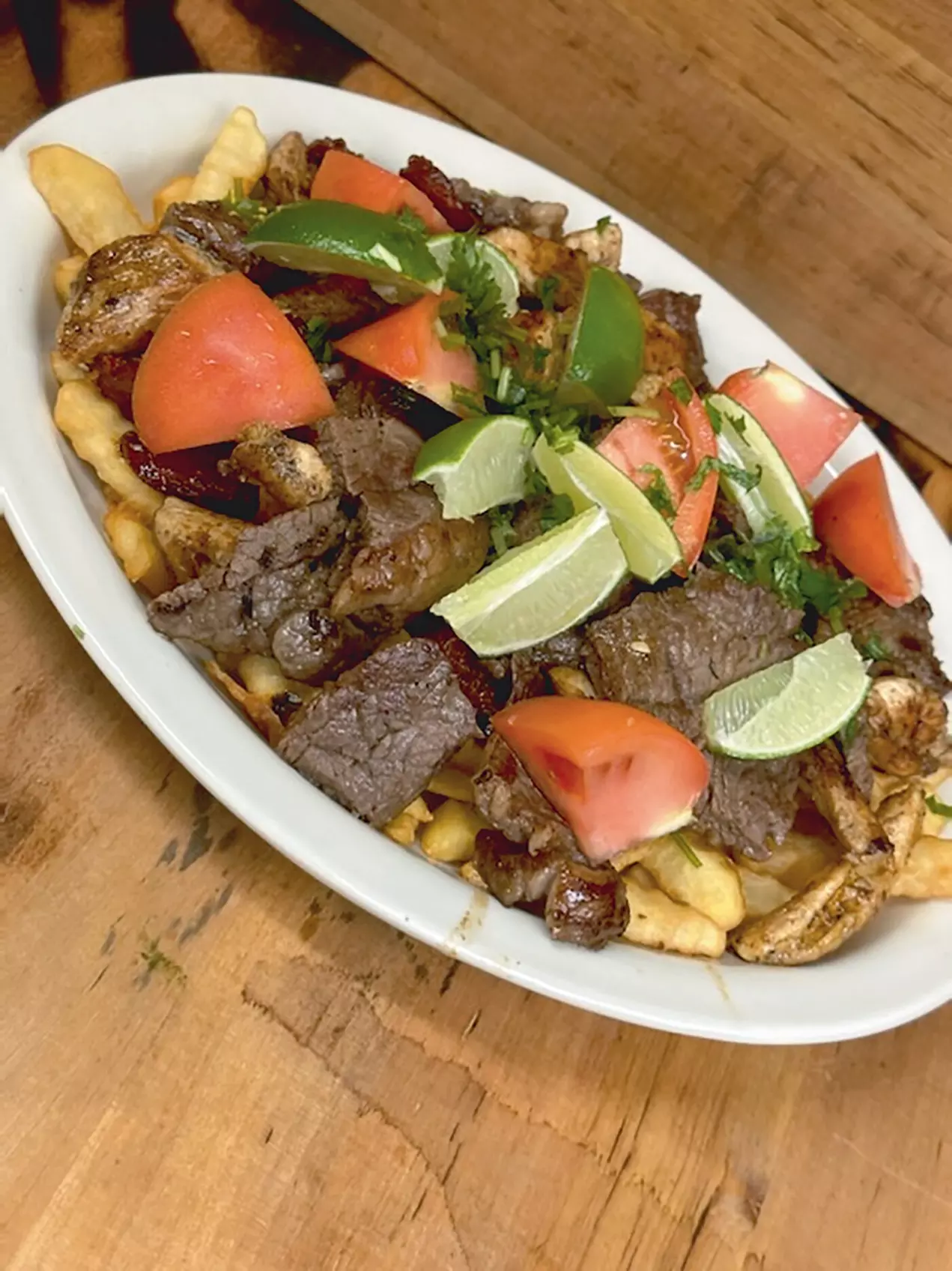 $10 For $20 Worth Of Colombian & Latin Food, Burgers, Tacos, Wings & More - Primary Image