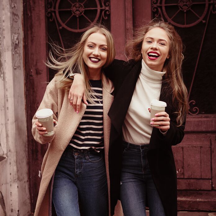 Friends smiling at the camera in a relaxed pose