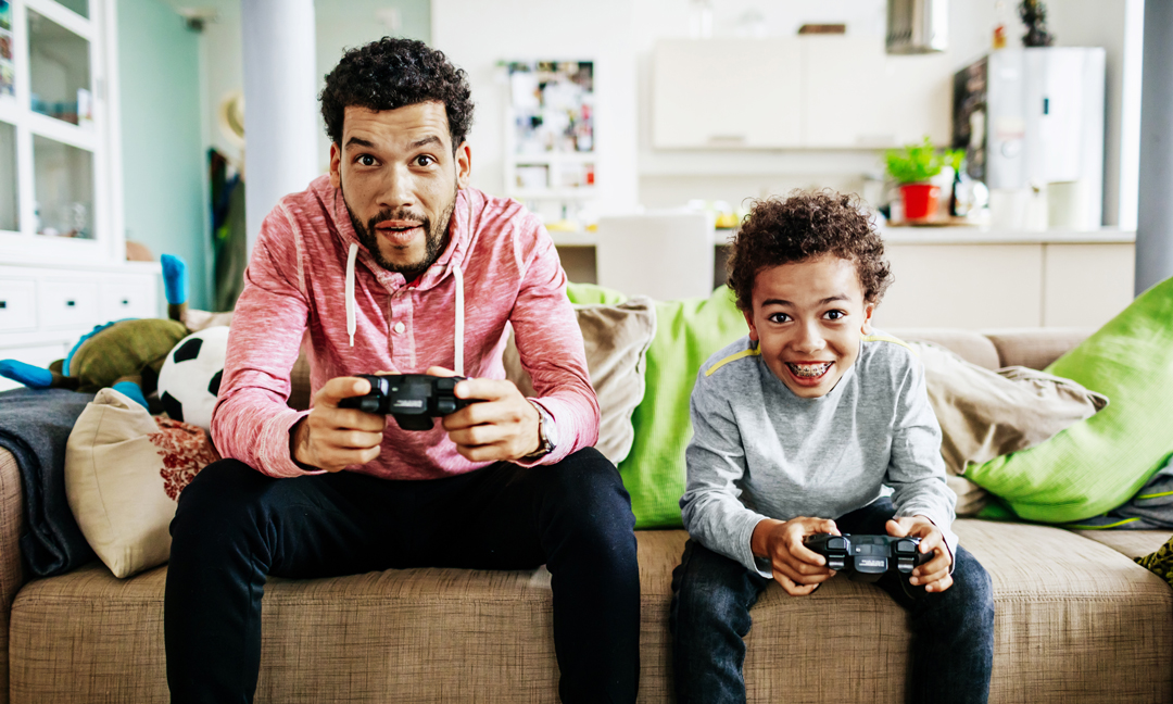 Father and son playing video games