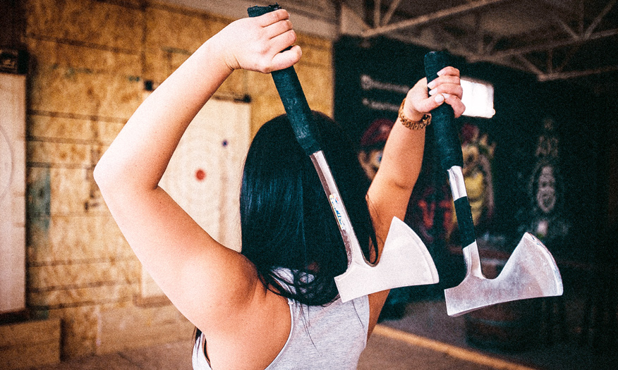 woman throwing axes
