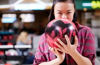 Woman holding bowling ball