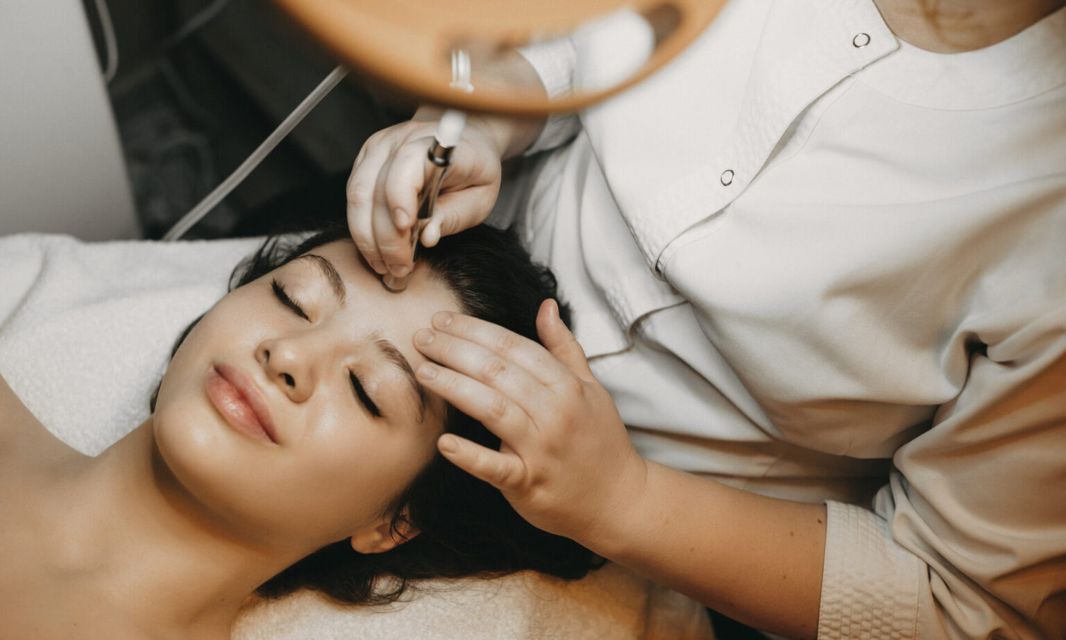 woman getting microneedling procedure