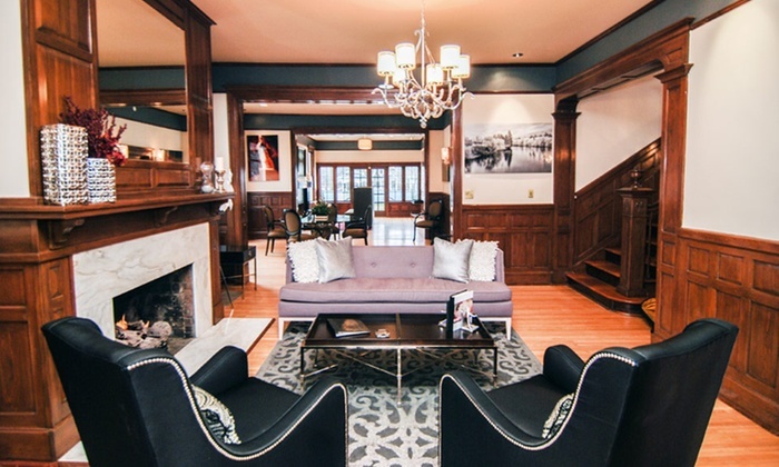 Lobby with couch and chairs by fireplace at Blackwell Hotel