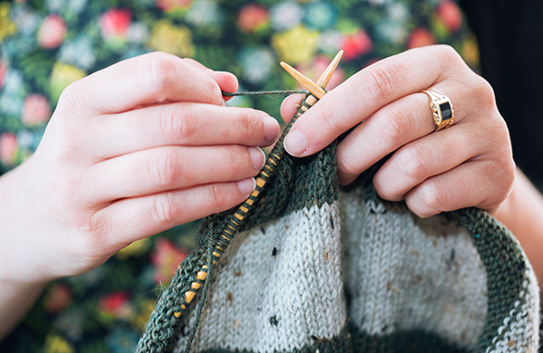 woman knitting sweater or scarf jpg
