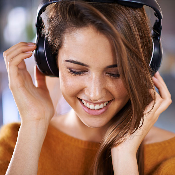 Woman listening to music with headphones