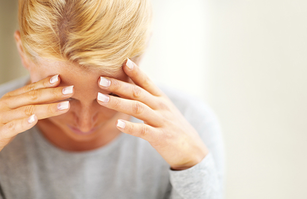 woman-holding-hurting-head