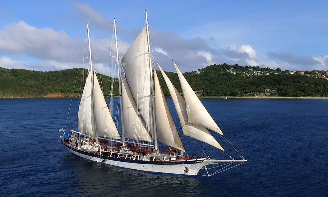 Tall ship cruise ship sailing on blue waters