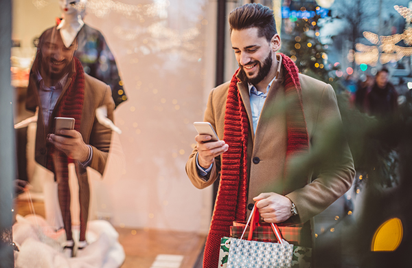 Man shopping on his phone during black friday