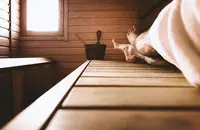 Man in wood sauna