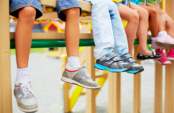 Baby children kids hanging feet wearing shoes