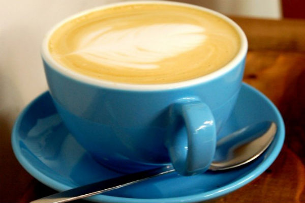 Cappucino in a blue coffee mug