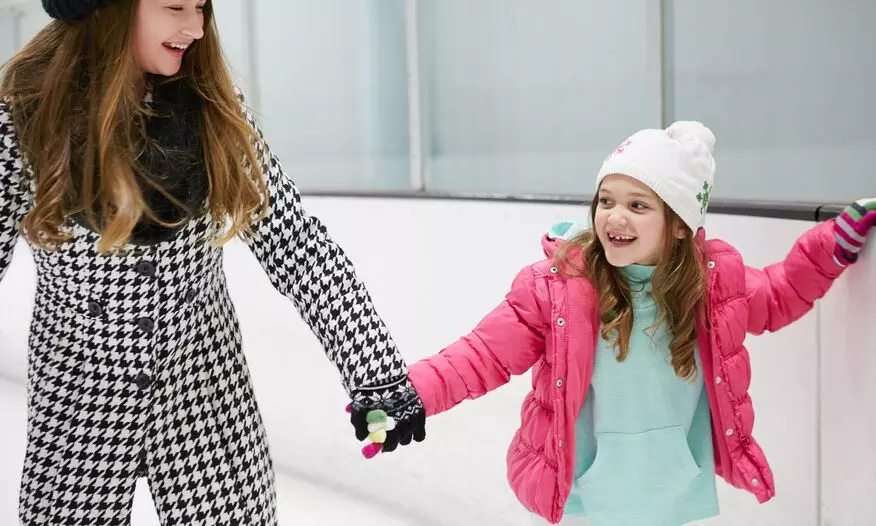 mom and daughter ice skating