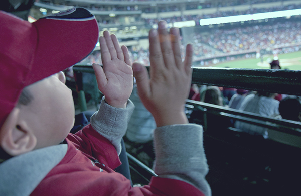 Small child enjoying sporting event