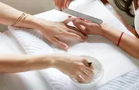 Woman getting nails filed
