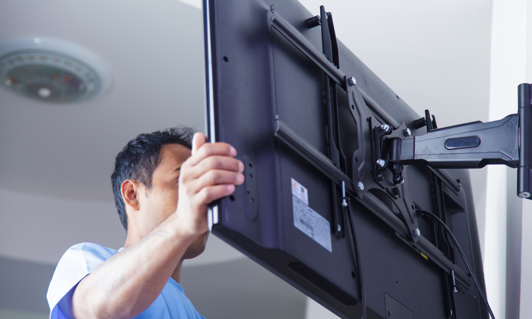 Man Installing Tv On Wall Using Mount Jpg 1080x648