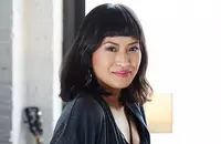 asian woman with lob and bangs smiling