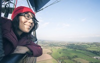 Woman riding hot-air balloon