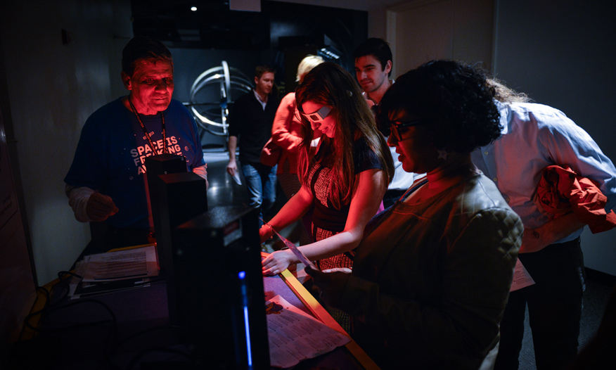 People doing a science experiment at the planetarium