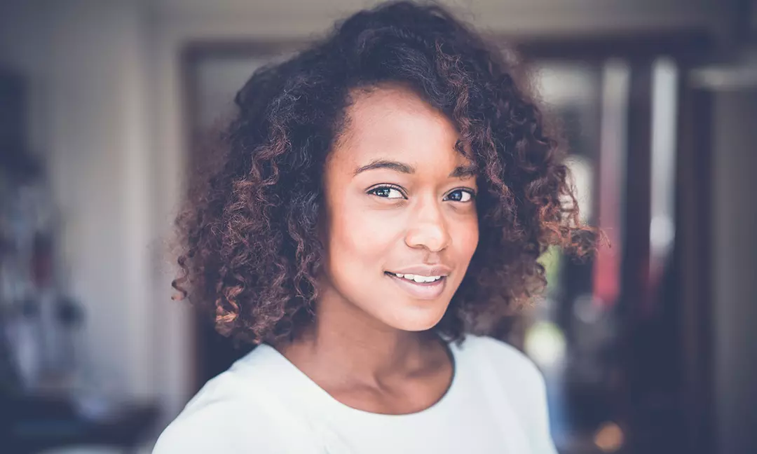 woman with glowing skin after using hyaluronic acid