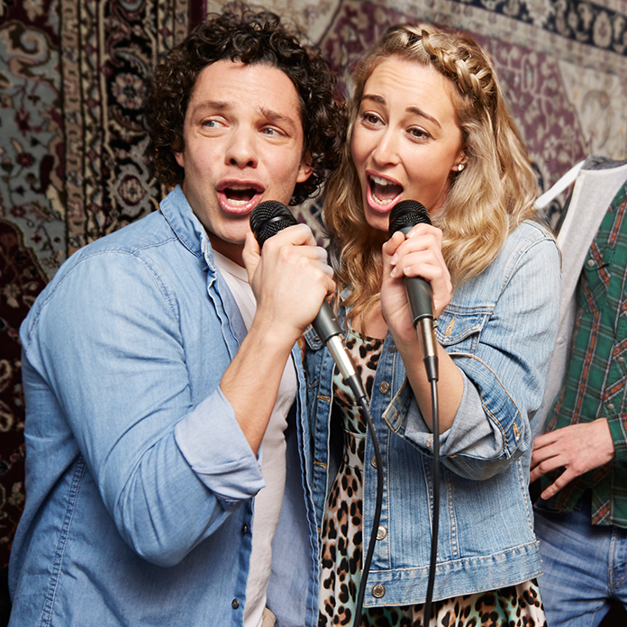Couple singing at karaoke