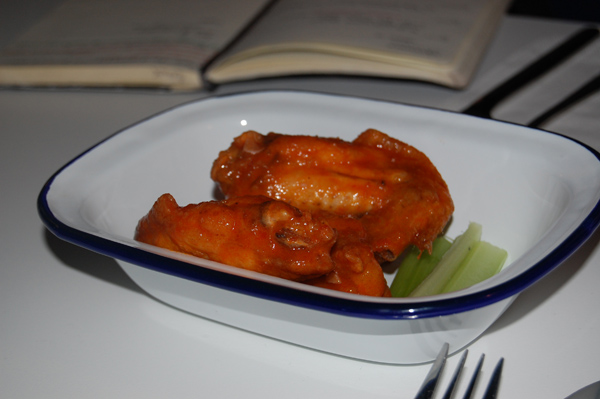 Three buffalo wings served with celery