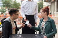 Couple on first date getting check