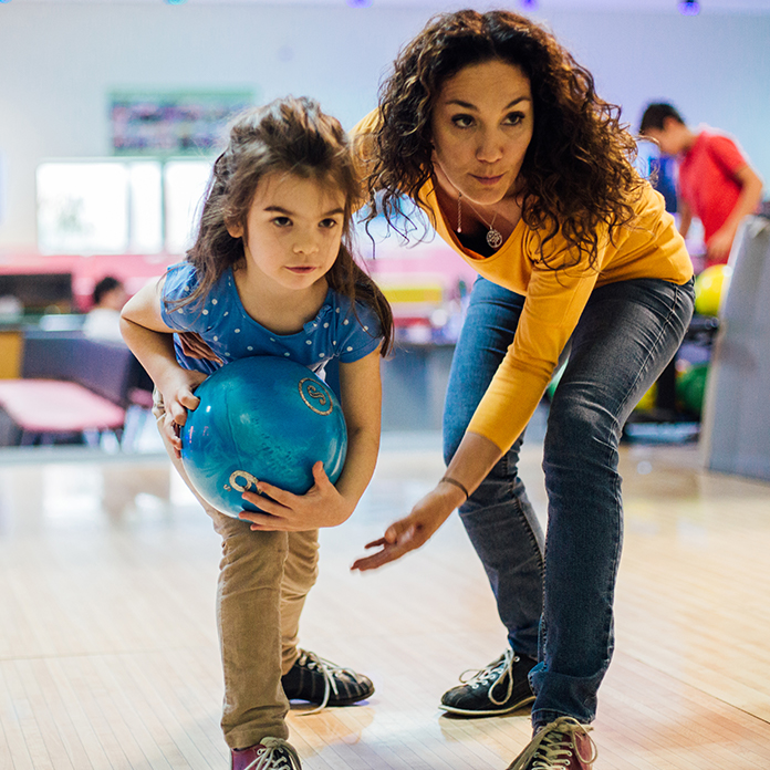 Mom and daughter bowling