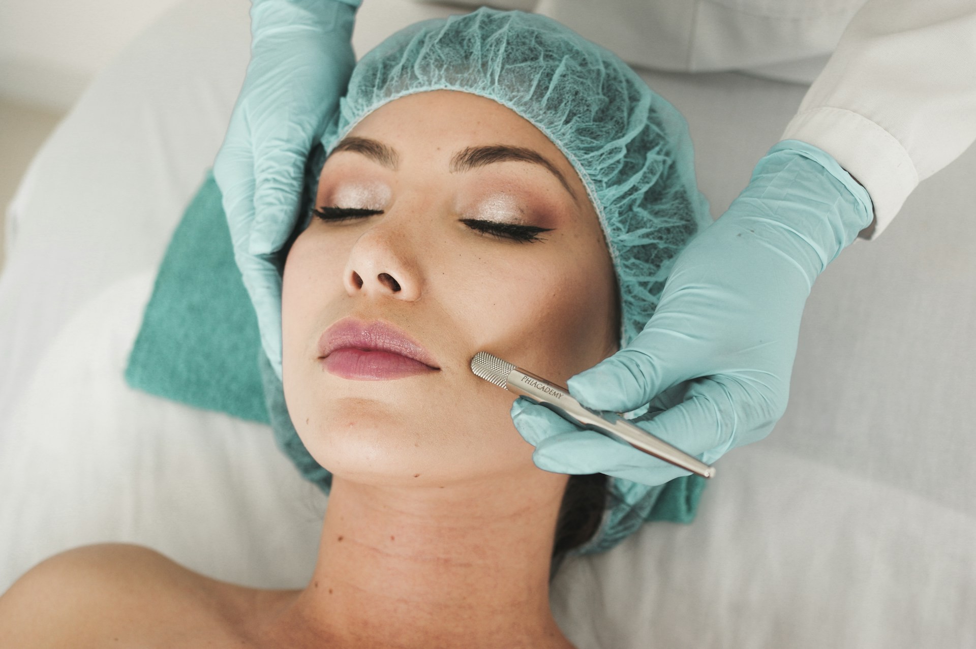 Woman receiving a cosmetic facial procedure at a medical aesthetics clinic
