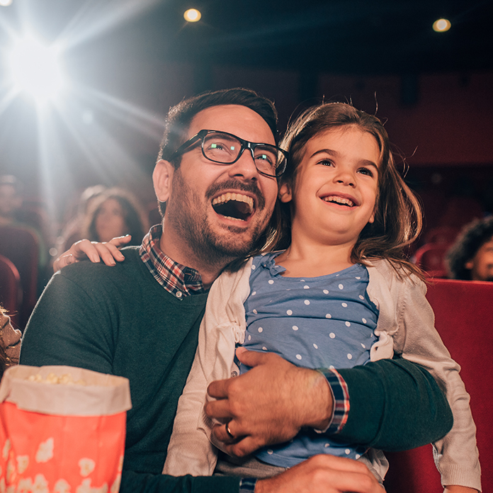 Daughter and Father at the Movie Theater