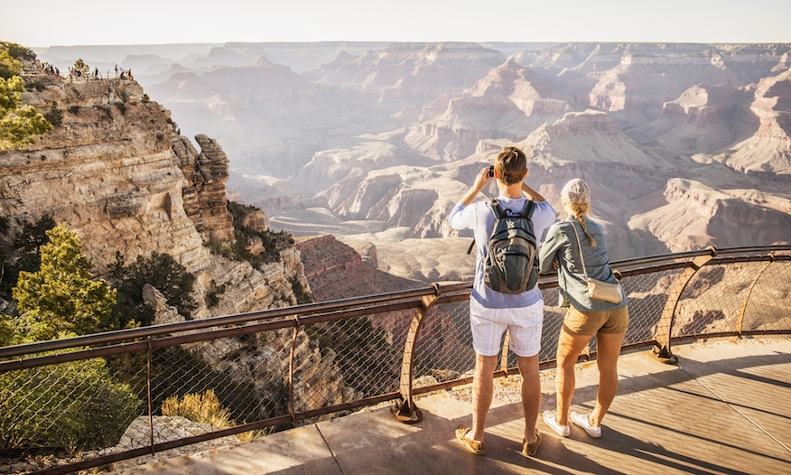 People looking out over Grand Canyon