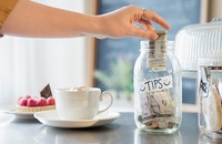 Dropping money in tip jar