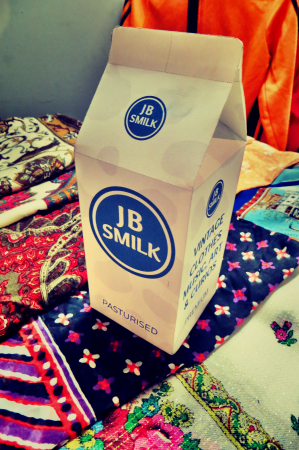 A box with JB Smilk Vintage Clothing logo